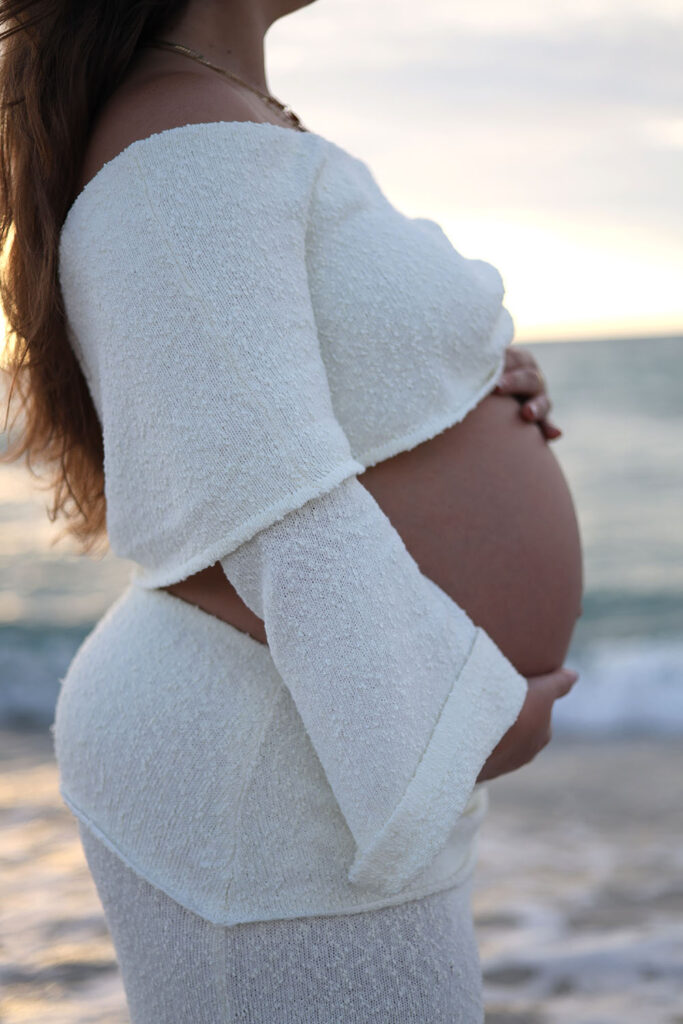 Photo of woman holding pregnant belly